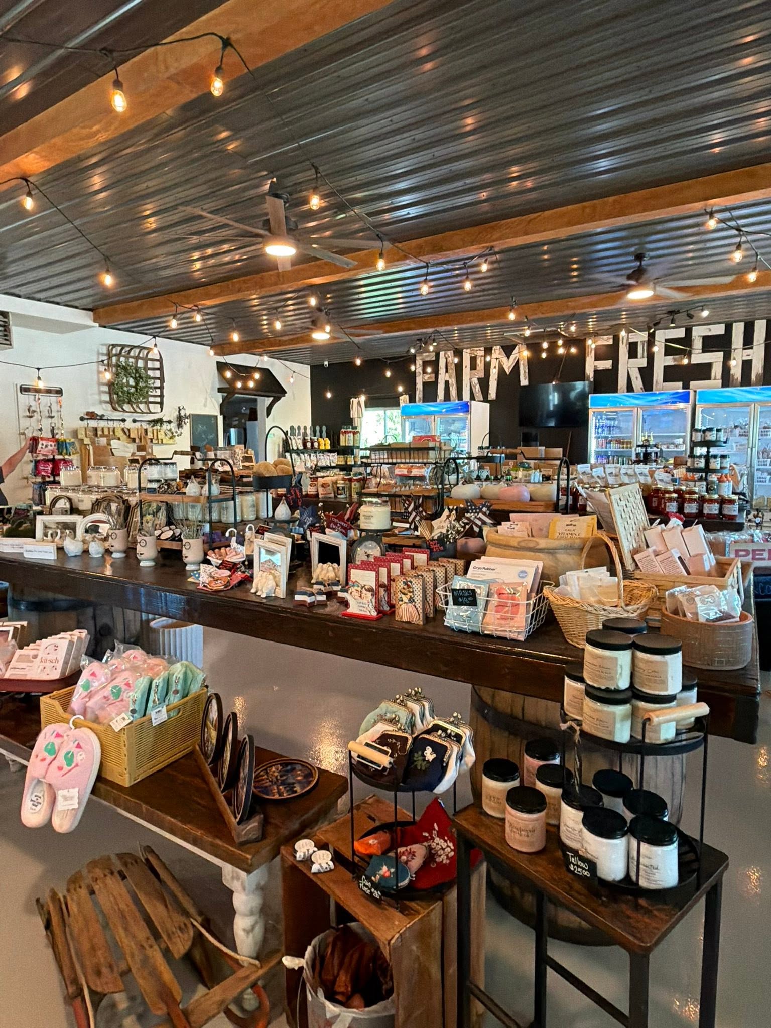 The warm, string-lit interior of the Bennington Farms market